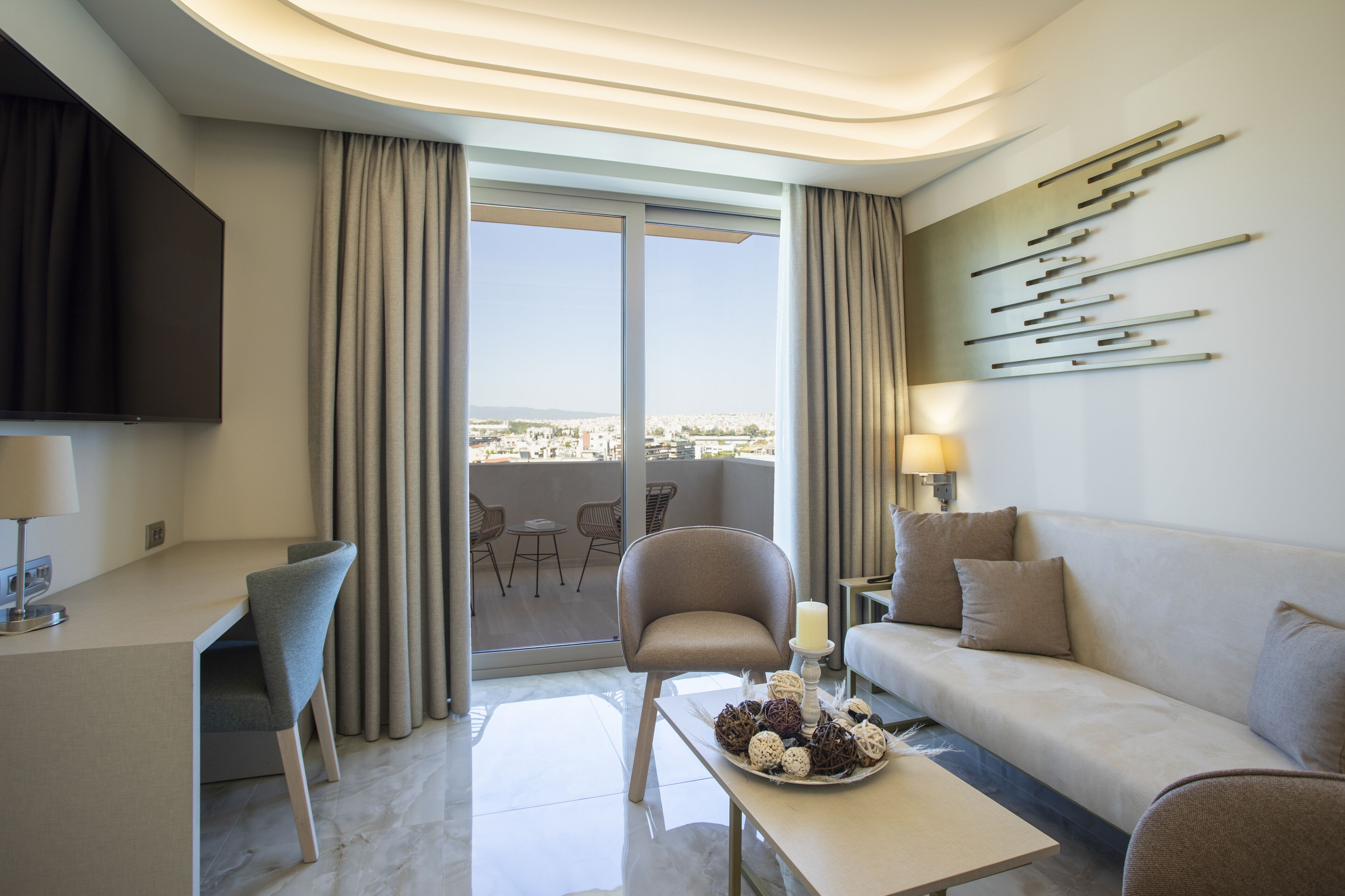 signature suite (athens view) | living area | 65-inch flat-screen tv with satellite channels, tv