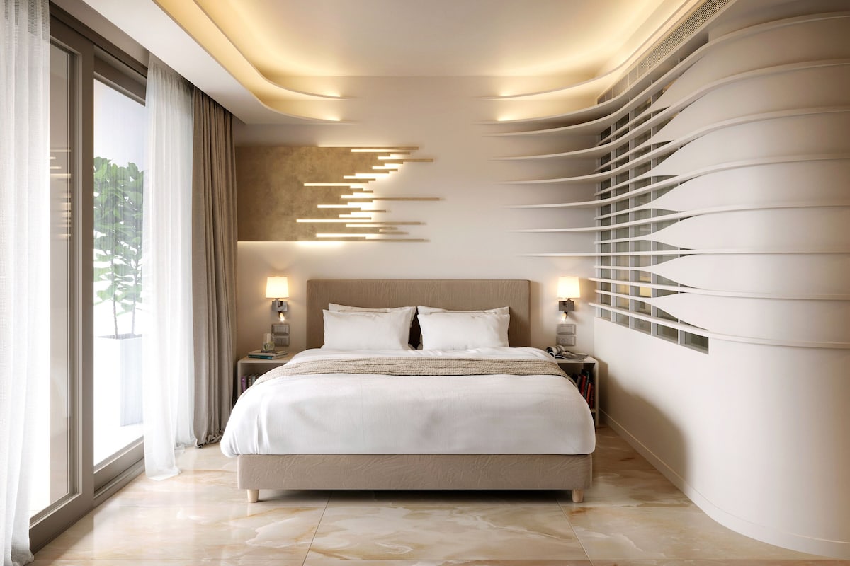 A modern bedroom with a large bed, bedside tables, and a unique wall design.