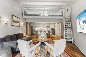 Living room:  Sofa seats , smart Tv and open concept space 