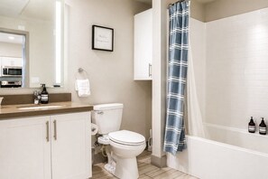 Clean full bathroom with a shower-tub combo and bright vanity - Resort-Style Condo 3 Miles to Disney (Fullerton)