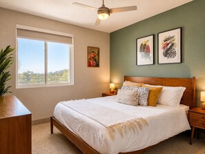 Bright bedroom with a comfortable bed, ceiling fan and sunny window - Resort-Style Condo 3 Miles to Disney (Fullerton)