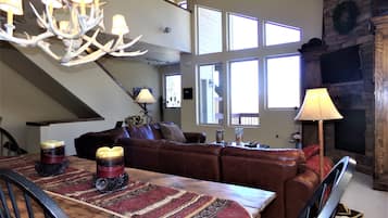 Flat-screen TV, fireplace, DVD player, streaming services