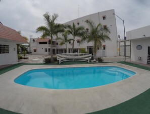 Outdoor pool, open 9:00 AM to 9:00 PM, free pool cabanas
