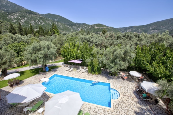 Seasonal outdoor pool, open 9:00 AM to 9:00 PM, pool umbrellas