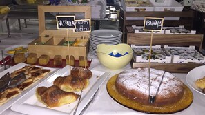 A buffet with various food items including pastries, cakes, and desserts. - Hotel Dea della Salute (Bellaria-Igea Marina)