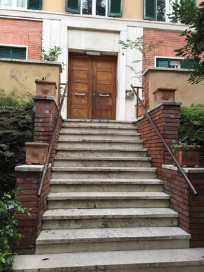 Exterior detail - a house with many outdoor spaces in the center of rome.  (Roma)