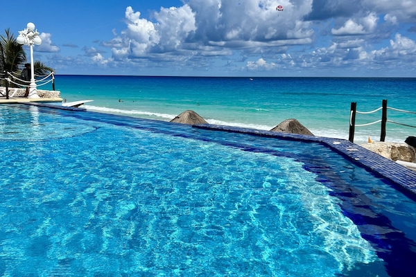 Outdoor pool, pool umbrellas, sun loungers