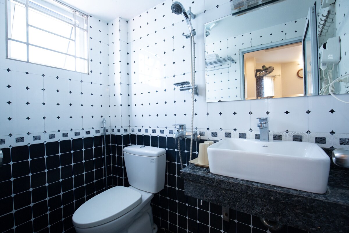 Bathroom | Shower, rainfall showerhead, hair dryer, slippers