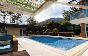 Outdoor pool, pool umbrellas, pool loungers