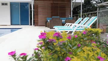 Outdoor pool, pool umbrellas, sun loungers