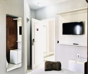 Frigobar, cortinas blackout, Wi-Fi de cortesia, roupa de cama