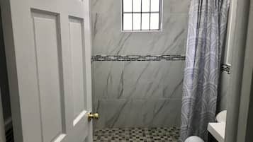 Standard Single Room | Bathroom | Shower, towels, toilet paper