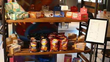A snack display with various chips and candies.