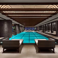 Indoor pool, open 5:00 AM to 11:00 PM, pool loungers