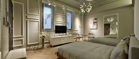 Signature Quadruple Room, 2 Double Beds | Minibar, individually decorated, desk, soundproofing