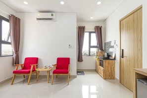 Premium bedding, minibar, desk, laptop workspace - Phan Anh Apartment (Ho Chi Minh City)