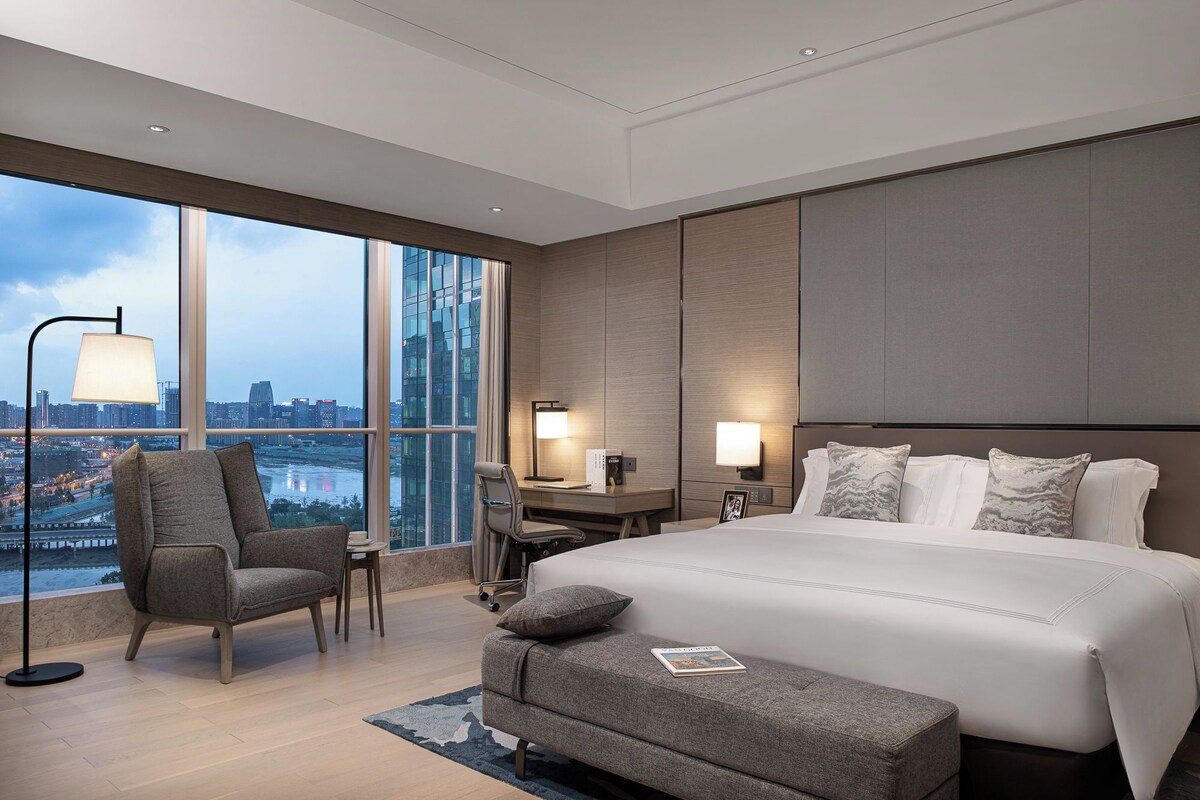 Deluxe Suite, 1 Bedroom | Down comforters, in-room safe, soundproofing, iron/ironing board