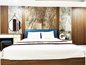 Relax in comfort with a large bed and modern amenities.