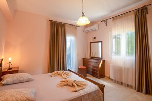 Relax in comfort with a large bed, dresser, and mirror.
