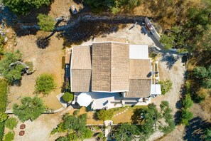 Set amidst a serene garden, this property offers a tranquil retreat with a large building and parking.