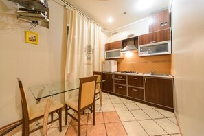 Apartment, 1 Bedroom | Private kitchenette | Fridge, microwave, stovetop, cookware/dishes/utensils - Cozy apartment near Olympic Stadium 2 (Kyiv)