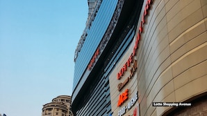 A building with the sign "LOTTES" and "FOOD AVENUE" indicating a shopping area. - De 80's Genteng Ijo (Jakarta)