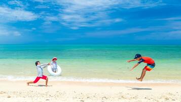 Beach nearby, white sand, beach towels