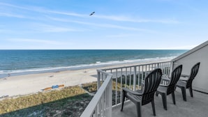 A balcony with a view of the beach and ocean. - Clean 6th Floor Oceanfront. Pool, Sundeck, Free Wifi | Crescent Sands WH - B6 (North Myrtle Beach)