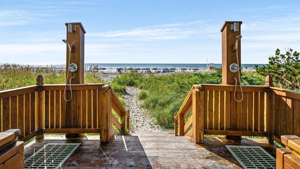 A wooden deck leading to a beach with a clear view of the ocean. - 7th Floor Windy Hill Condo. Fitness Room, Pools, Wifi | Windy Hill Dunes - 704 (North Myrtle Beach)