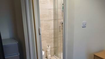 Shower, towels, soap, toilet paper