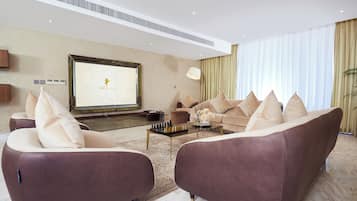 Presidential Suite | Living area | 50-inch Smart TV with satellite channels