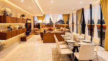 Presidential Suite | Living area | 50-inch Smart TV with satellite channels