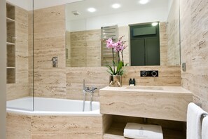Combined shower/tub, hair dryer, towels, soap