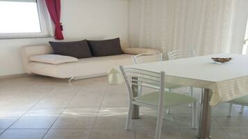 Apartment, 1 Bedroom (1) | Living area | Flat-screen TV