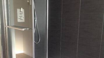 Shower, towels, soap, toilet paper