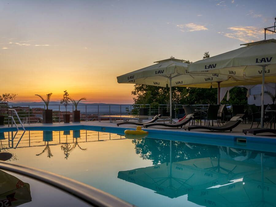 Outdoor pool, open 9:00 AM to 7:00 PM, sun loungers