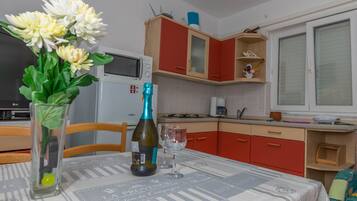 Apartment, 2 Bedrooms | Private kitchen | Full-sized fridge, oven, stovetop, coffee/tea maker