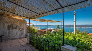 Enjoy the serene sea views from this outdoor space.