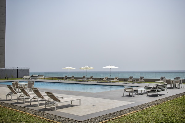 2 outdoor pools, pool umbrellas, pool loungers