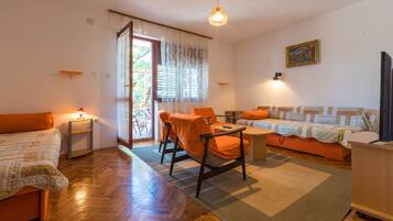 Apartment, 2 Bedrooms | Living area | Flat-screen TV