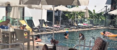 Seasonal outdoor pool, pool umbrellas