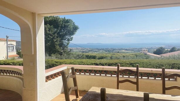 A balcony with a view of a coastal landscape, including trees and distant buildings. - Ref. Nav51 -  (Rosas / Roses)