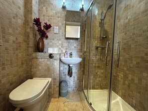 Shower, hair dryer, towels, soap