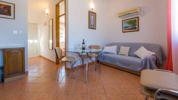 Apartment, 1 Bedroom, Sea View | Living area | TV