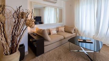 Apartment, 2 Bedrooms, Sea View | Living area | Flat-screen TV