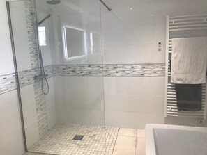 Bathtub, hair dryer, towels, soap