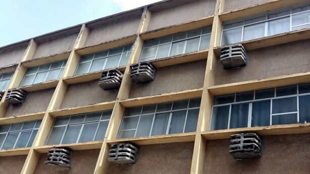 A building facade with multiple windows and air conditioning units. - Hotel Amazônia Belém (Belém)