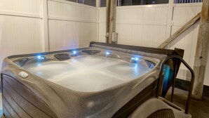 A hot tub with a control panel and a wooden ladder. - Sea Chique | Ocean View Beach House with Private Pool and Hot Tub (Surfside Beach)