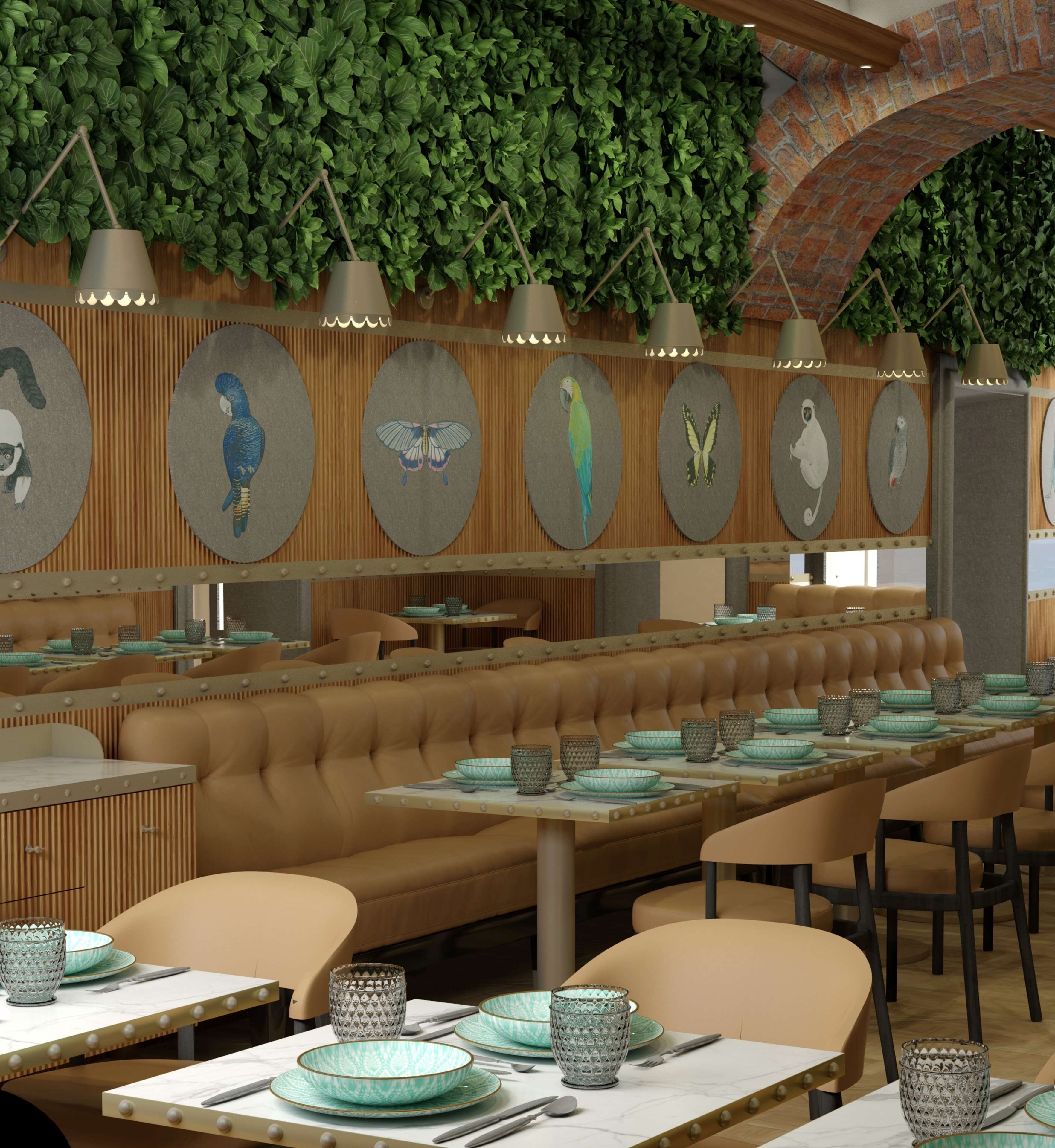 A restaurant with a long counter, cushioned booths, and a green leafy wall.