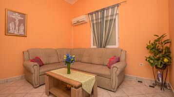 Apartment, 2 Bedrooms | Living room | Flat-screen TV